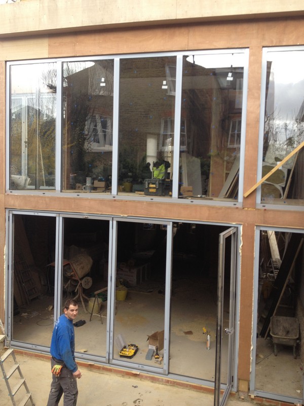 Aluminium bi-fold doors with two-storey glazing in Clapham Junction