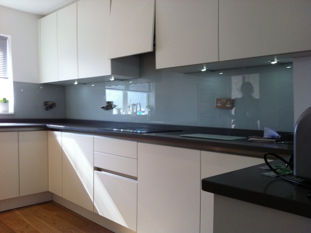 Grey glass kitchen splashback with LED lighting in Clapham Junction